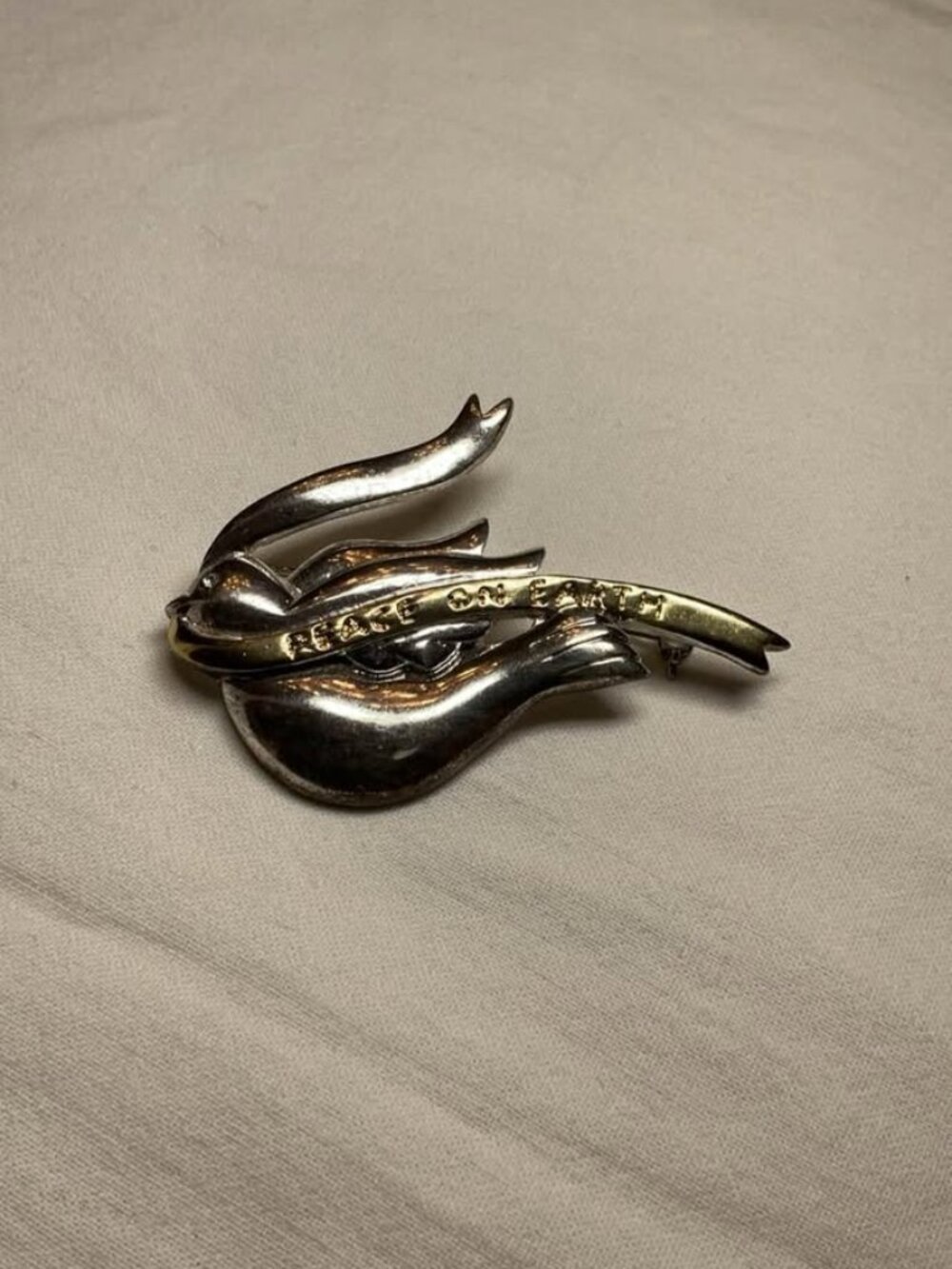 Vintage silver and gold-tone Peace on Earth bird brooch